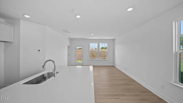 a view of a kitchen area with furniture and window
