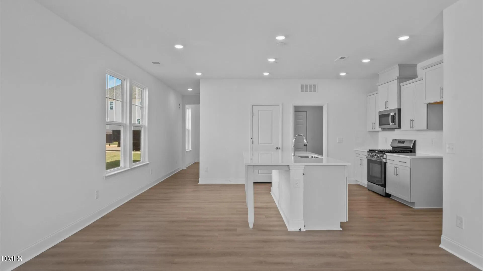 23 Gerrad Street, Unit 68 Franklinton, NC 27525 - Photo 10 of 23 a kitchen with stainless steel appliances granite countertop a refrigerator and a stove top oven