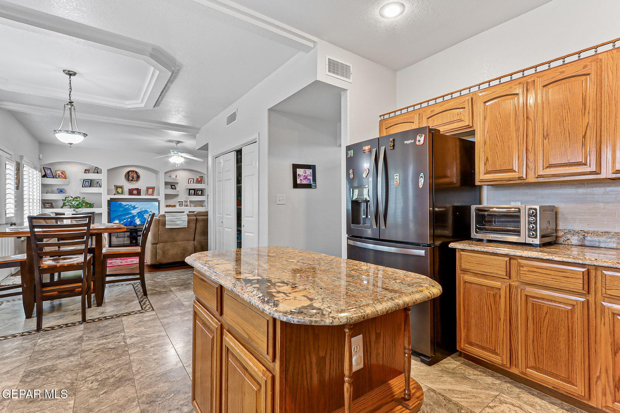6544 Royal Ridge Drive El Paso, TX 79912 - Photo 20 of 58 a kitchen with stainless steel appliances granite countertop a sink a stove and refrigerator