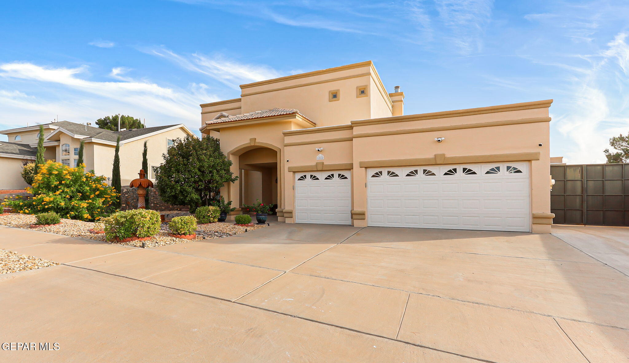 6544 Royal Ridge Drive El Paso, TX 79912 - Photo 2 of 58 a view of garage with a white house