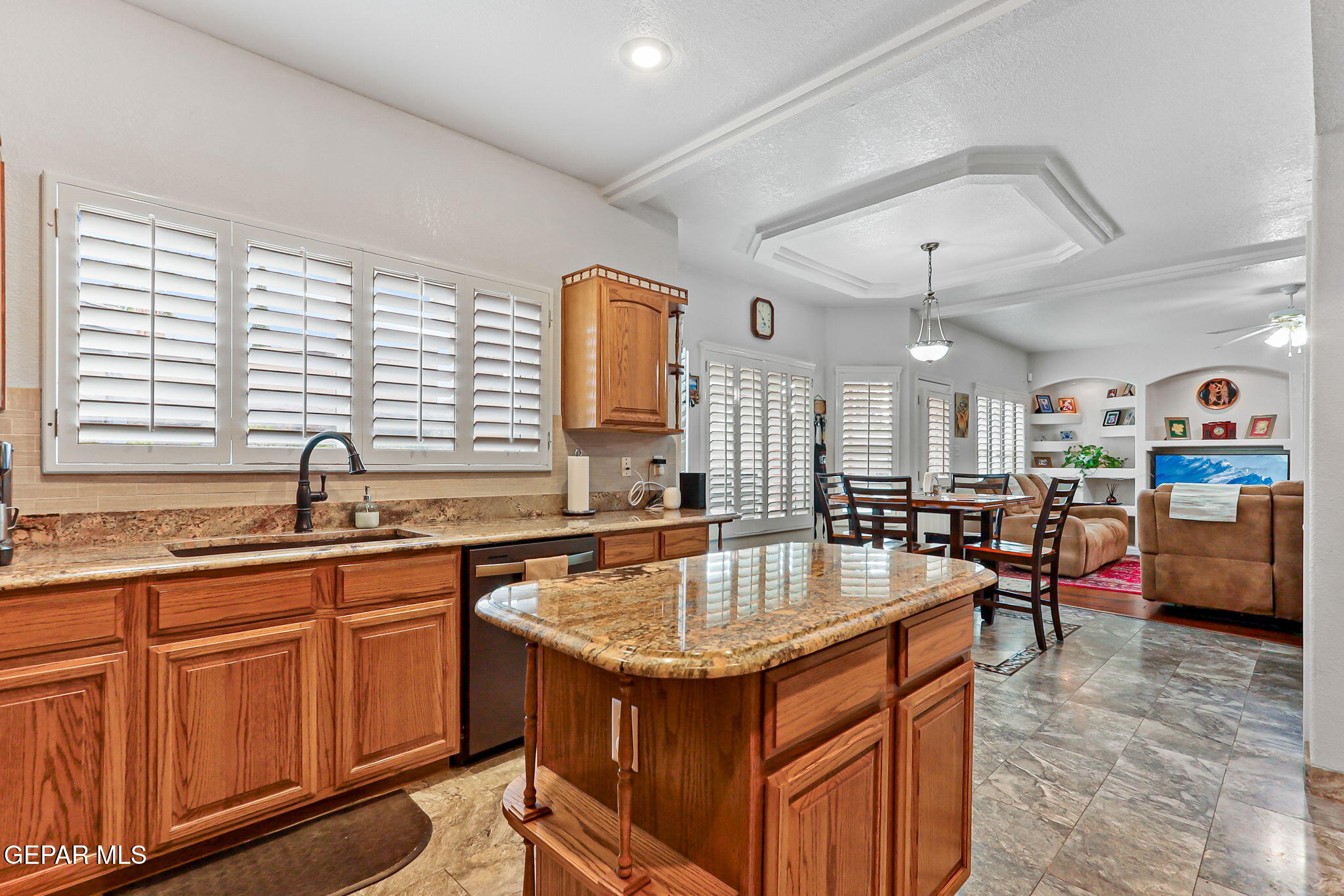 6544 Royal Ridge Drive El Paso, TX 79912 - Photo 22 of 58 a kitchen with sink cabinets and window