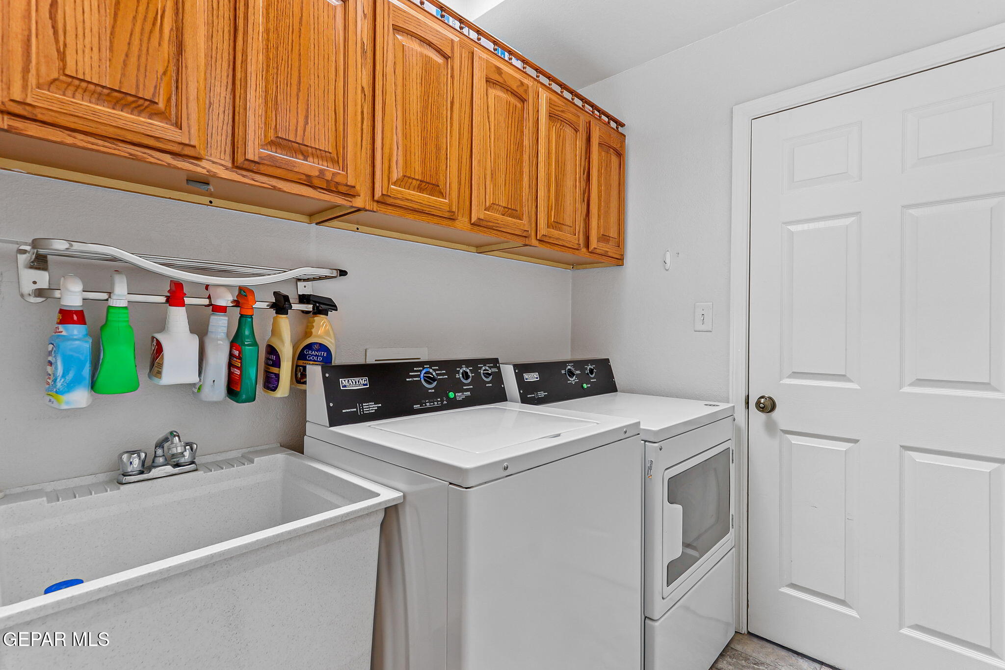 6544 Royal Ridge Drive El Paso, TX 79912 - Photo 24 of 58 a utility room with dryer and washer