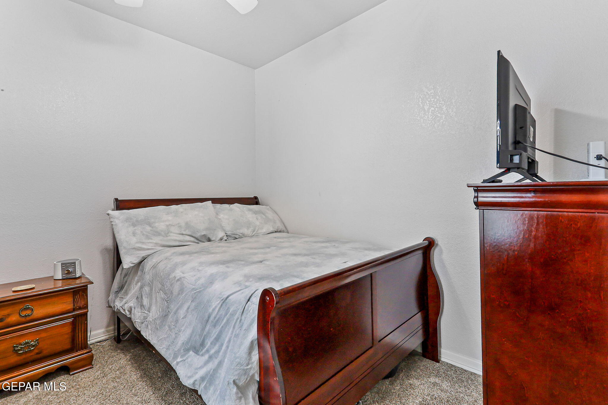 6544 Royal Ridge Drive El Paso, TX 79912 - Photo 28 of 58 a bedroom with a bed and wooden floor