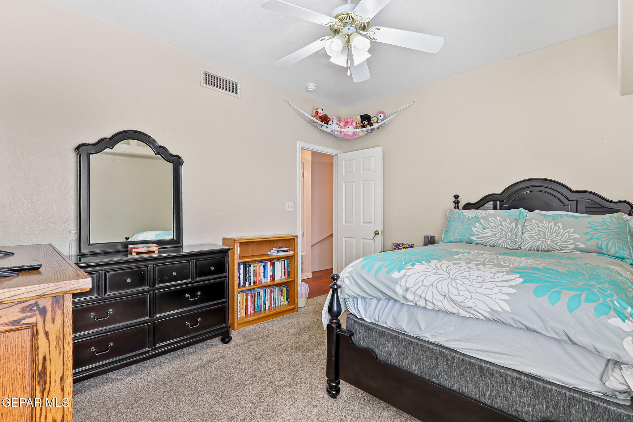 6544 Royal Ridge Drive El Paso, TX 79912 - Photo 30 of 58 a bedroom with a bed and dresser