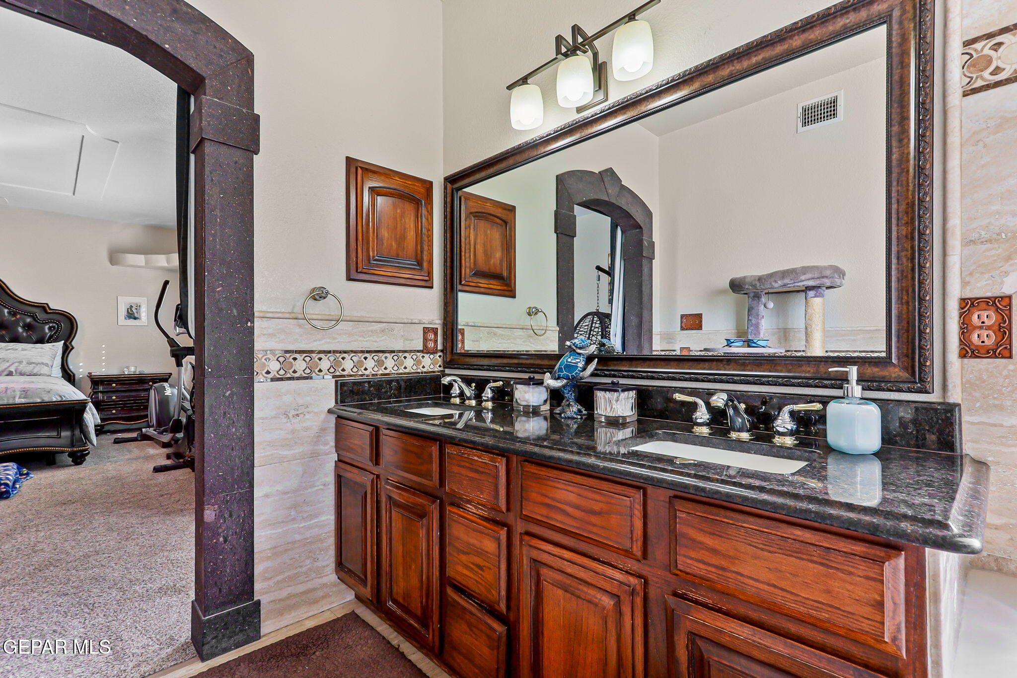 6544 Royal Ridge Drive El Paso, TX 79912 - Photo 33 of 58 a bathroom with sink and mirror