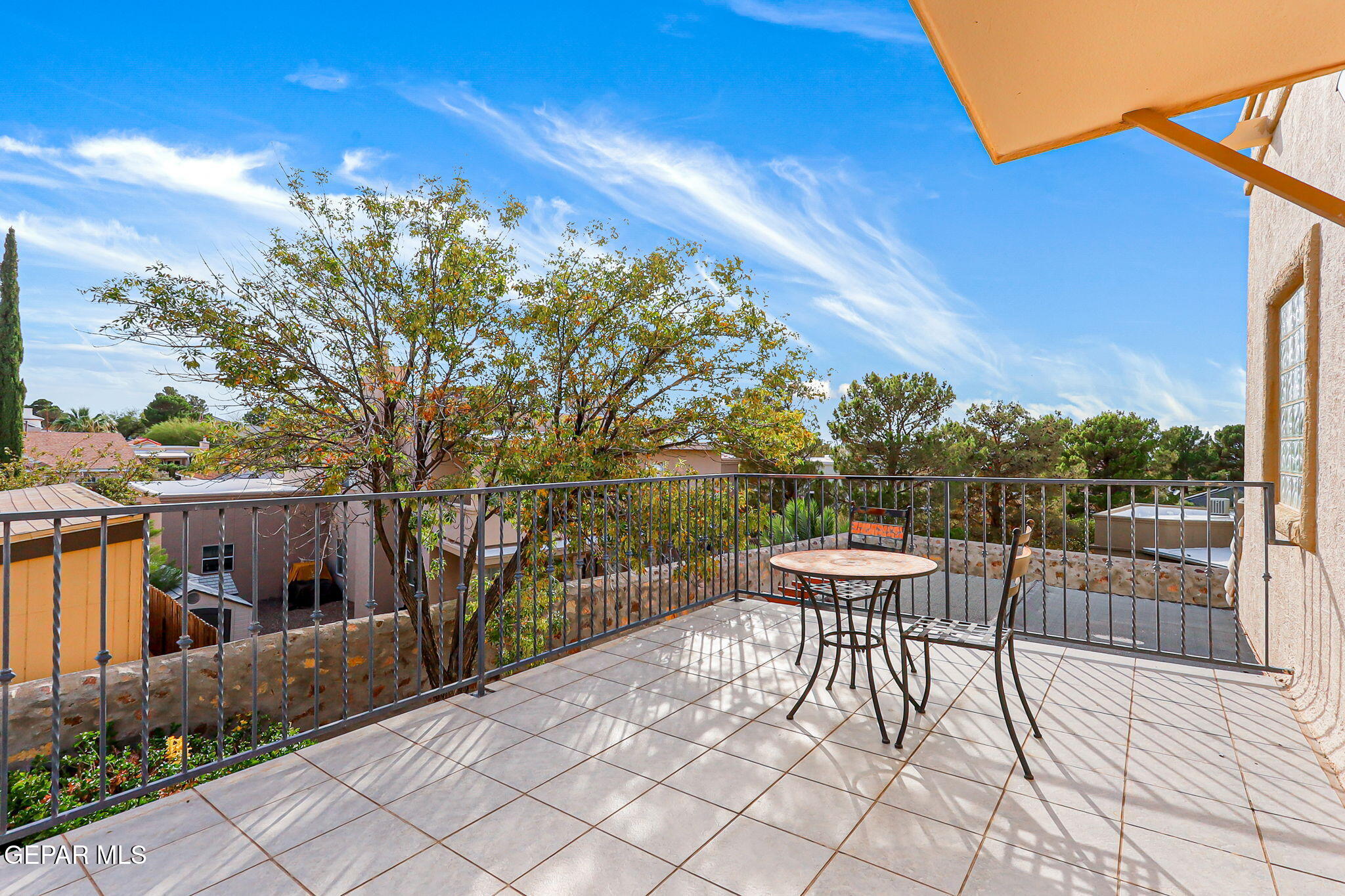 6544 Royal Ridge Drive El Paso, TX 79912 - Photo 45 of 58 a roof deck with table and chairs and potted plants