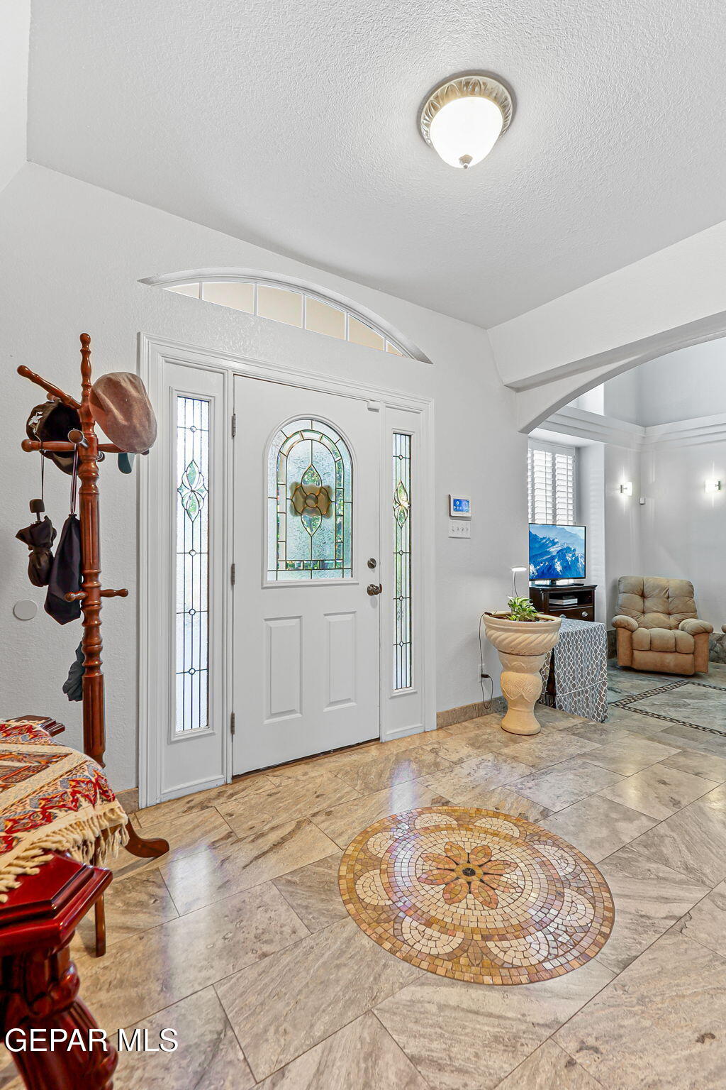 6544 Royal Ridge Drive El Paso, TX 79912 - Photo 5 of 58 a living room with furniture and a wooden floor