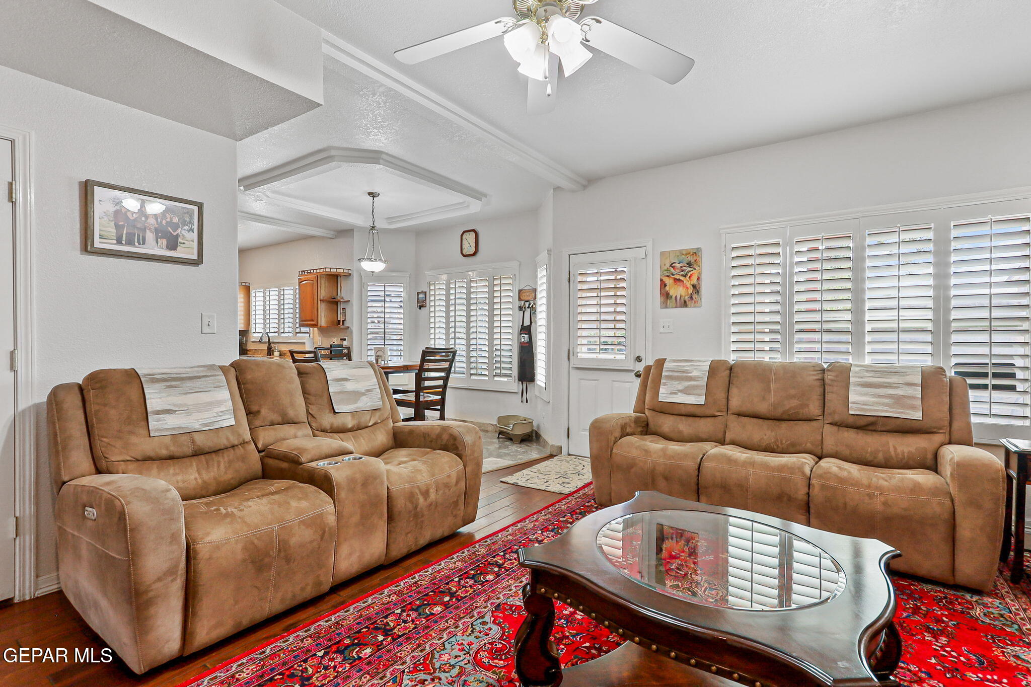 6544 Royal Ridge Drive El Paso, TX 79912 - Photo 8 of 58 a living room with furniture and a chandelier
