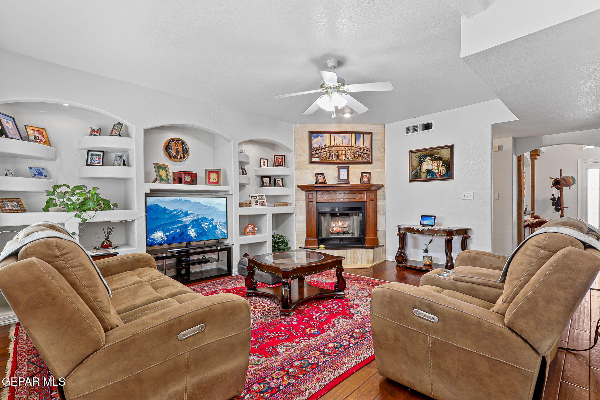 6544 Royal Ridge Drive El Paso, TX 79912 - Photo 9 of 58 a living room with furniture and a flat screen tv