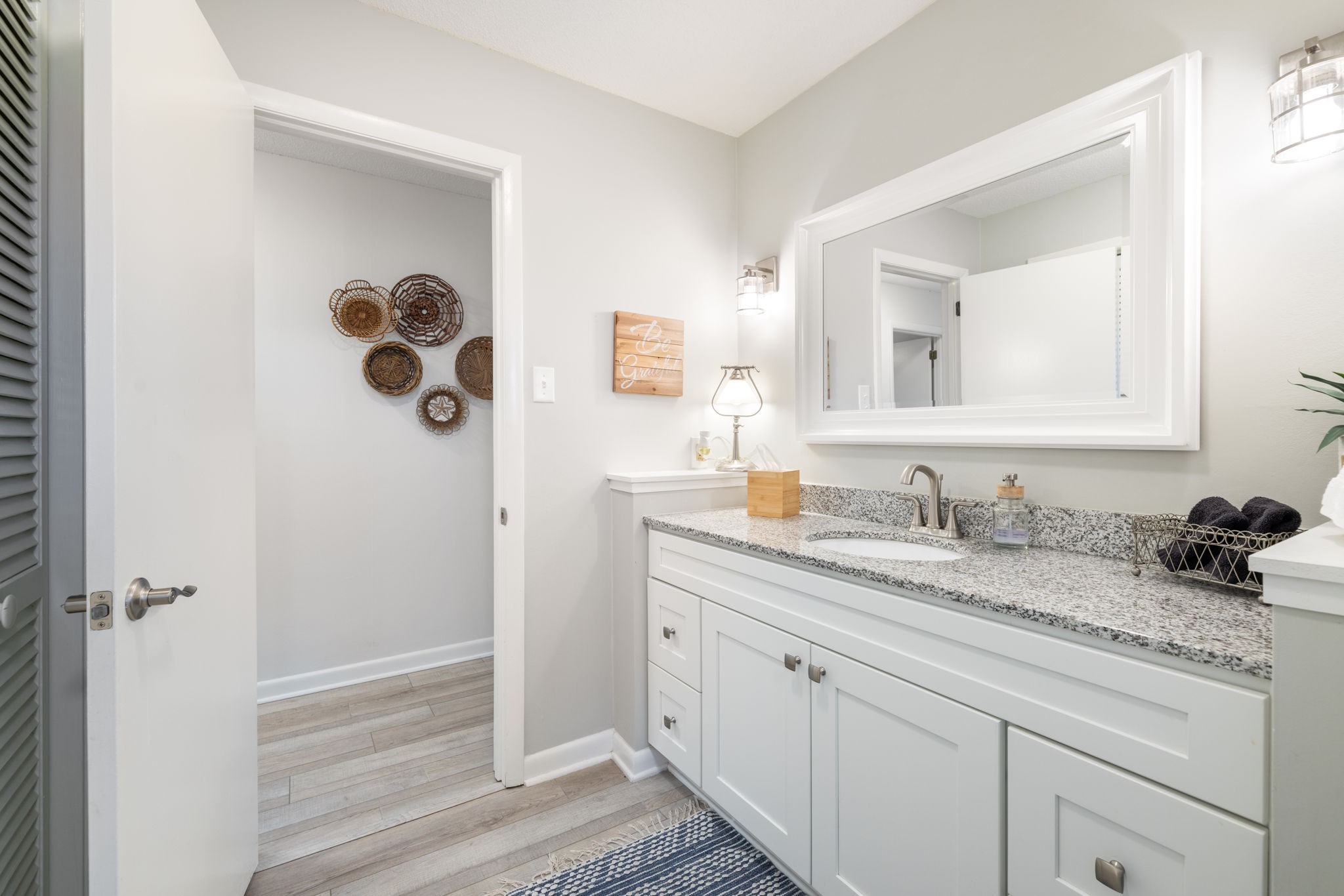 1755 Mc Bride Road Lewisburg, TN 37091 - Photo 38 of 59 a bathroom with a granite countertop sink and a mirror