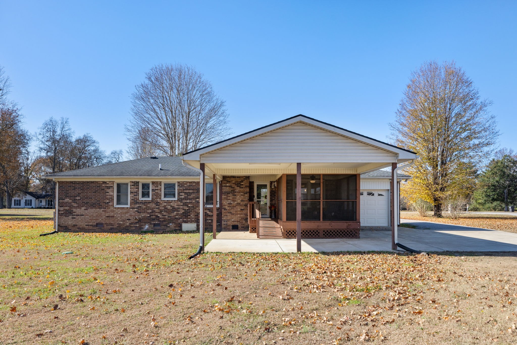 1755 Mc Bride Road Lewisburg, TN 37091 - Photo 52 of 59 a front view of a house with a yard and potted plants