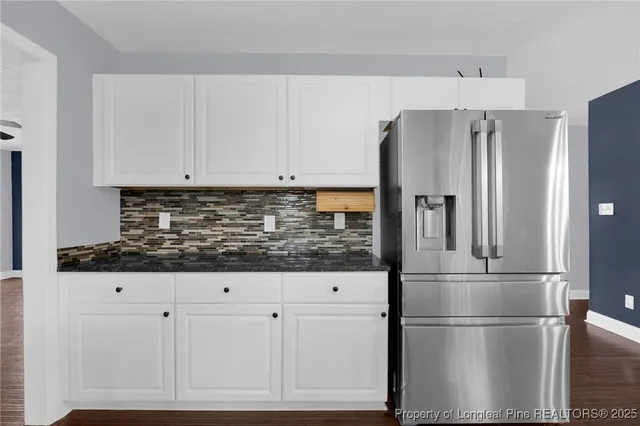 a kitchen with appliances and cabinets