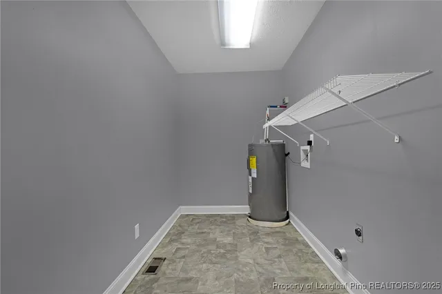 a view of a storage & utility room with a window