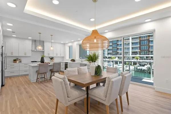 a kitchen with white cabinets stove and white cabinets