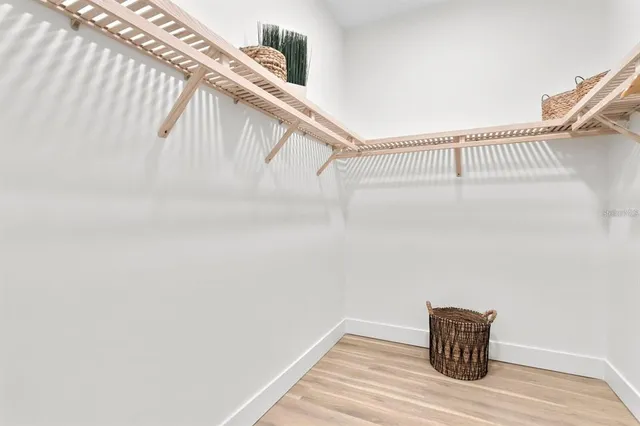 a spacious bathroom with double sink and a mirror