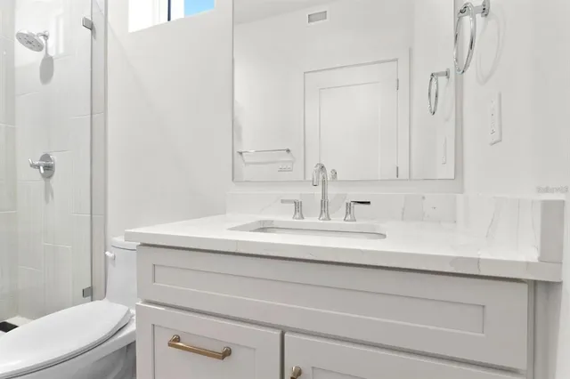 a dining room with furniture a fireplace and wooden floor
