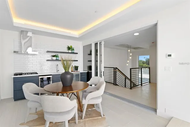 a view of a room with wooden floor and floor to ceiling window