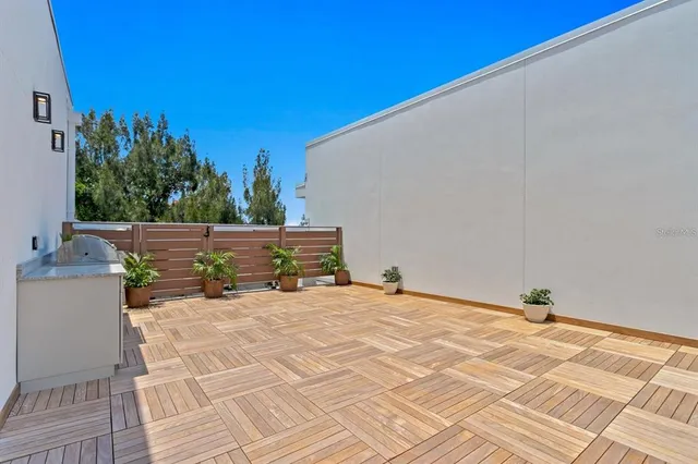 a kitchen with stainless steel appliances a sink a stove and a window