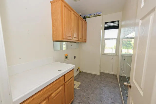 a room with a wooden floor and window