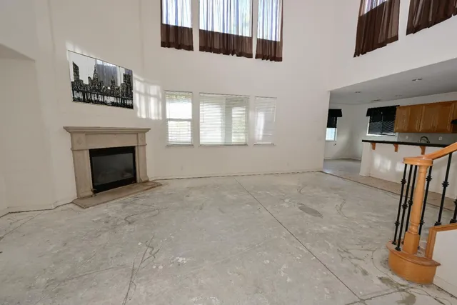 a view of a livingroom with furniture and a fireplace