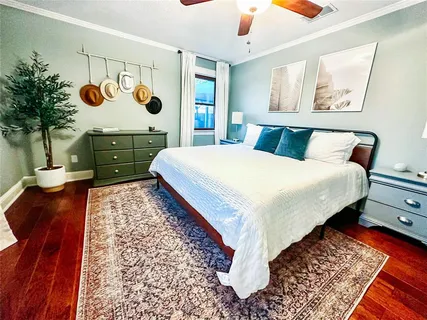 a bed sitting in a bedroom next to a window