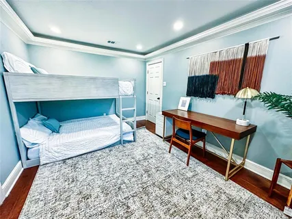 a living room with furniture and a rug