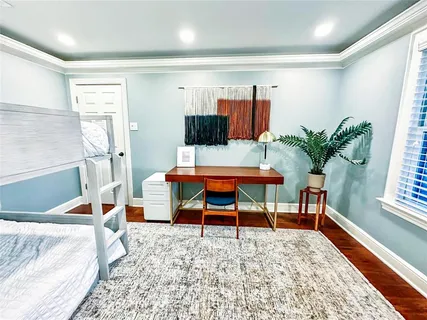 a bedroom with furniture and a bed