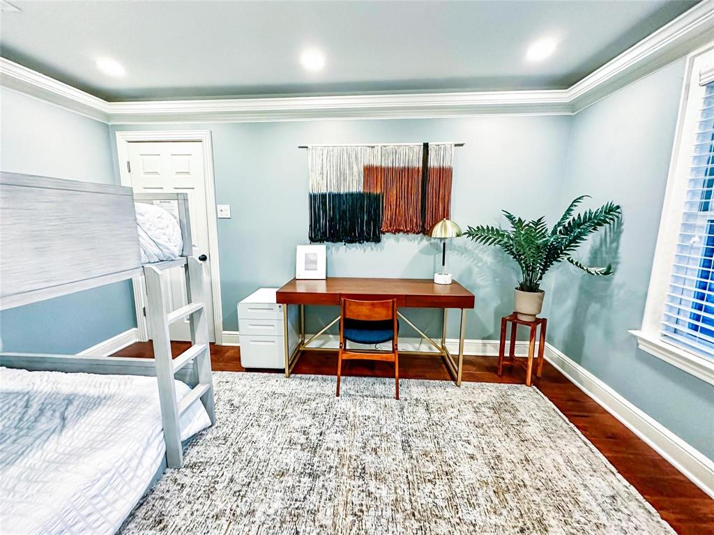 1114 Northwest 14th Street Grand Prairie, TX 75050 - Photo 15 of 19 a bedroom with furniture and a bed