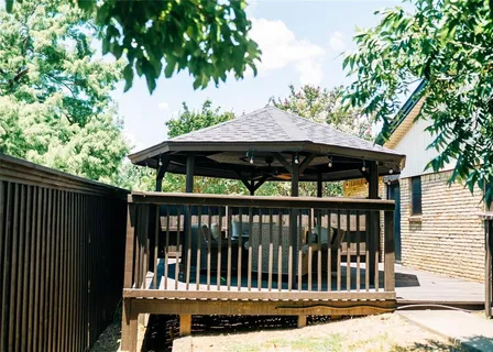 a view of a chair and table in the balcony