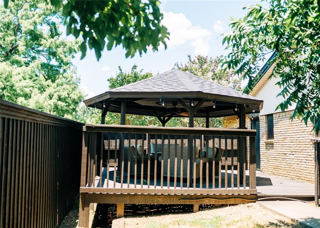 1114 Northwest 14th Street Grand Prairie, TX 75050 - Photo 17 of 19 a view of a chair and table in the balcony