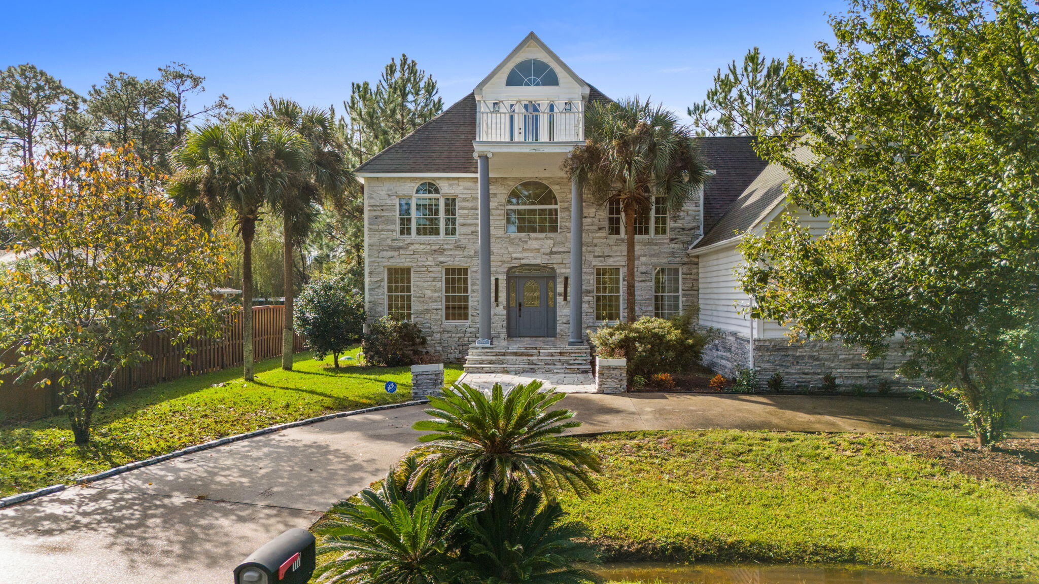 117 Santa Barbara Avenue Santa Rosa Beach, FL 32459 - Photo 1 of 116 a view of a big yard with potted plants and large tree
