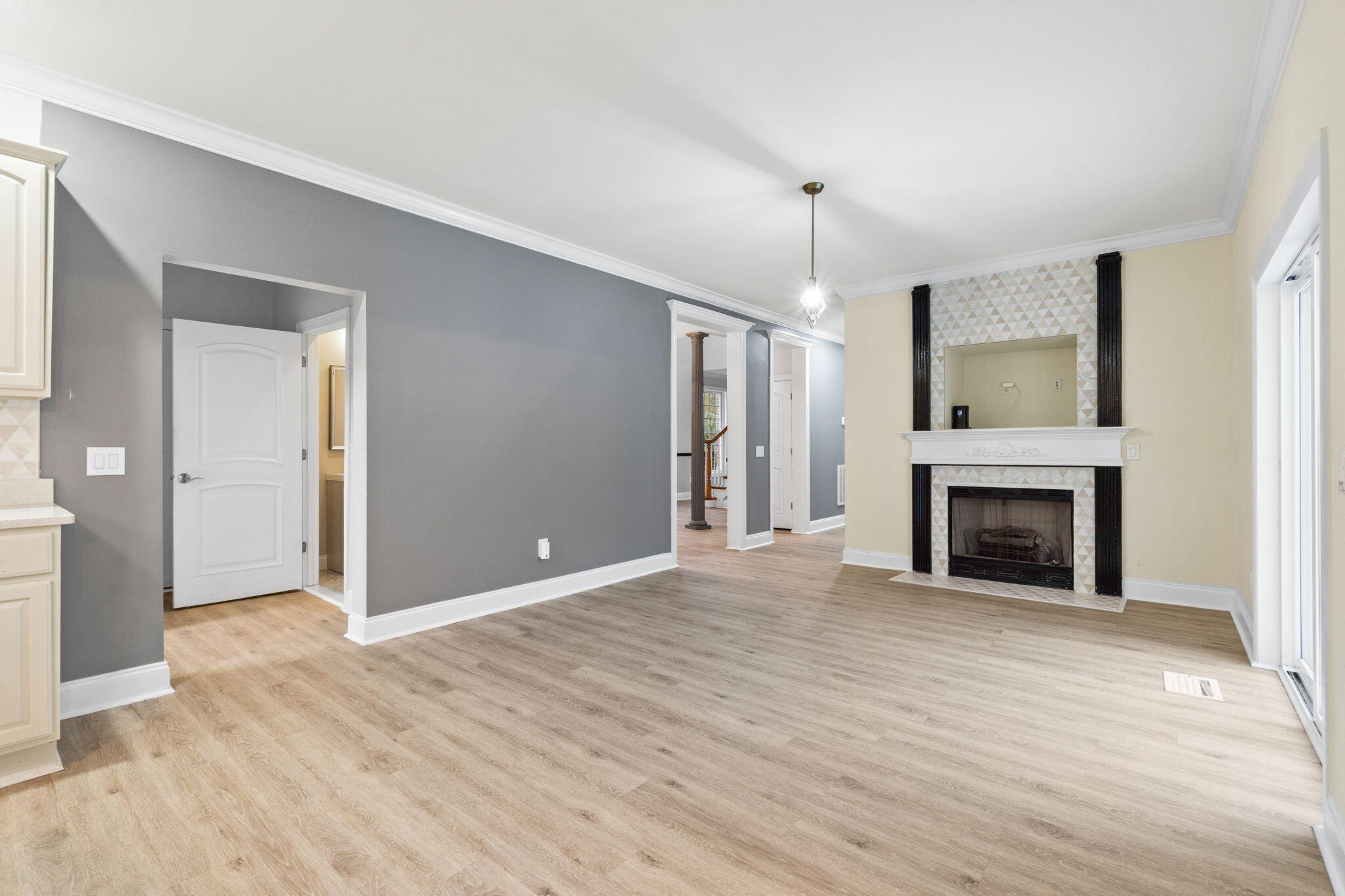 117 Santa Barbara Avenue Santa Rosa Beach, FL 32459 - Photo 14 of 116 wooden floor fireplace and windows in an empty room