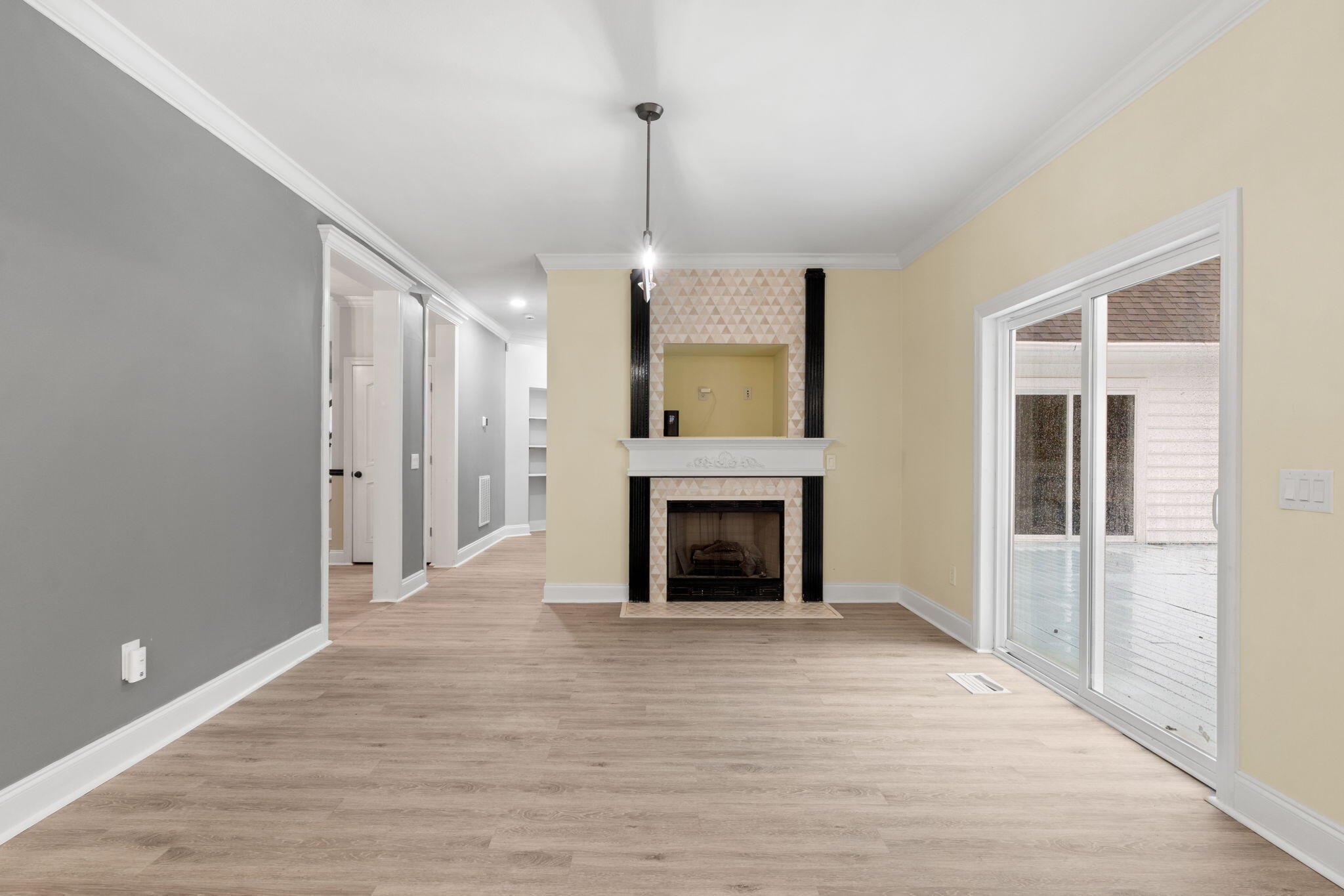 117 Santa Barbara Avenue Santa Rosa Beach, FL 32459 - Photo 25 of 116 a view of a livingroom with wooden floor a fireplace and windows
