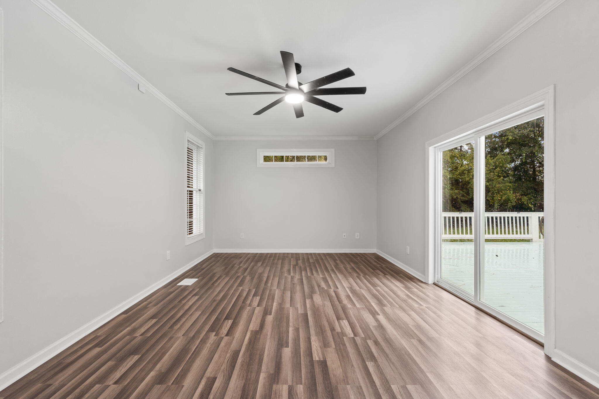 117 Santa Barbara Avenue Santa Rosa Beach, FL 32459 - Photo 28 of 116 a view of empty room with wooden floor and fan