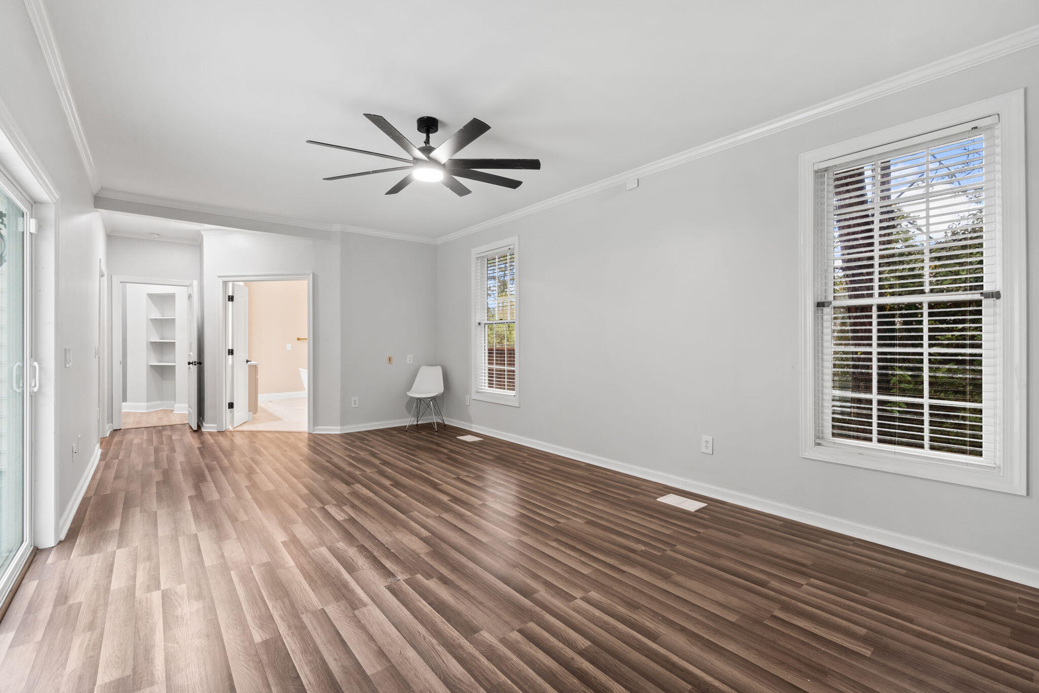117 Santa Barbara Avenue Santa Rosa Beach, FL 32459 - Photo 29 of 116 a view of empty room with wooden floor and fan