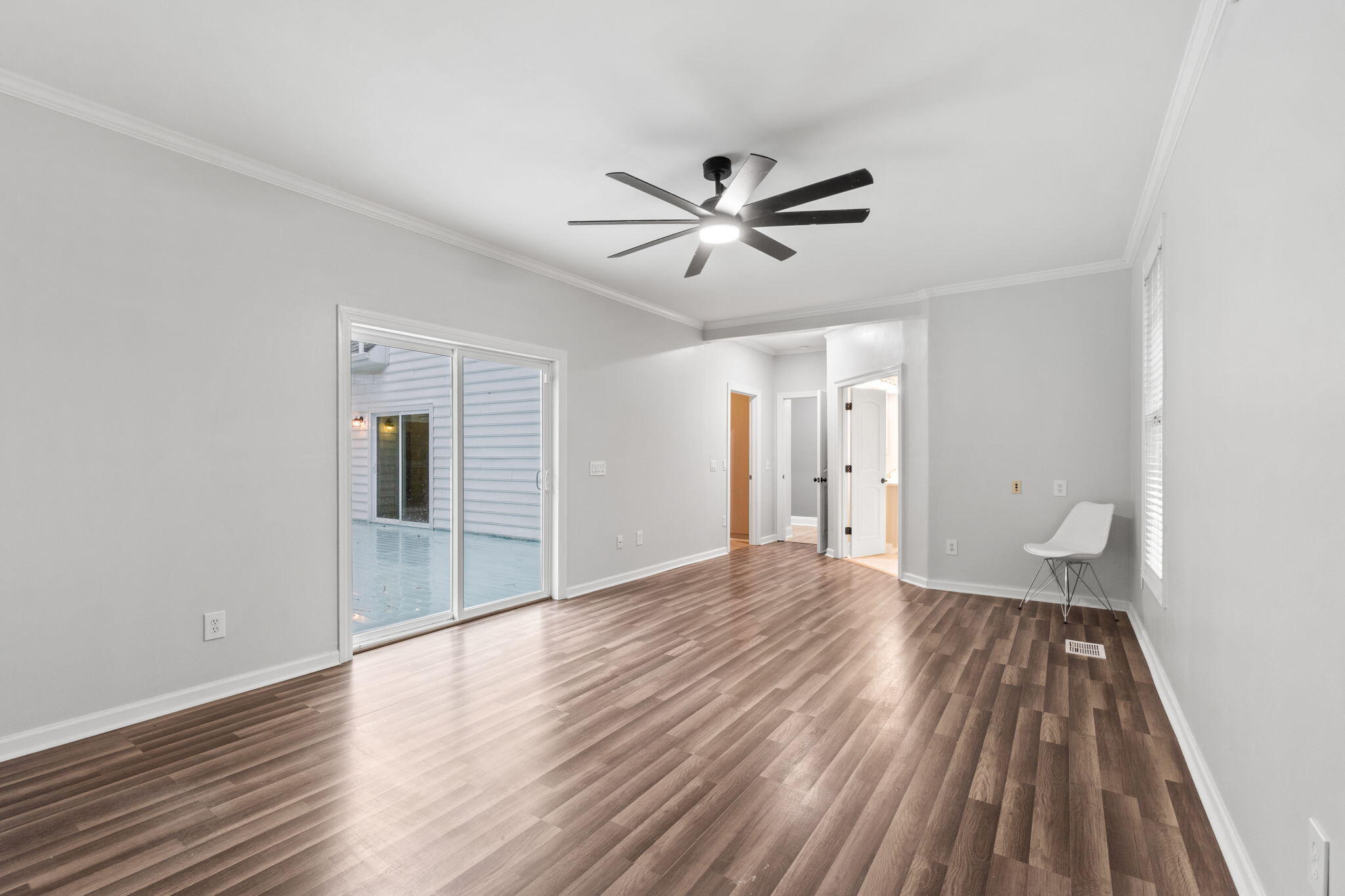 117 Santa Barbara Avenue Santa Rosa Beach, FL 32459 - Photo 30 of 116 a view of empty room with wooden floor and fan