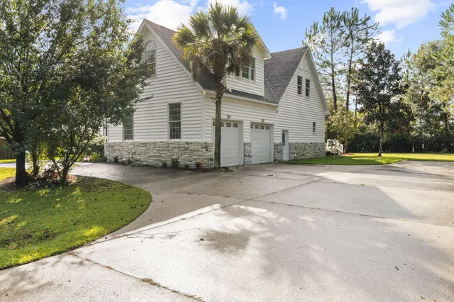 a view of an entryway with wooden floor and windows