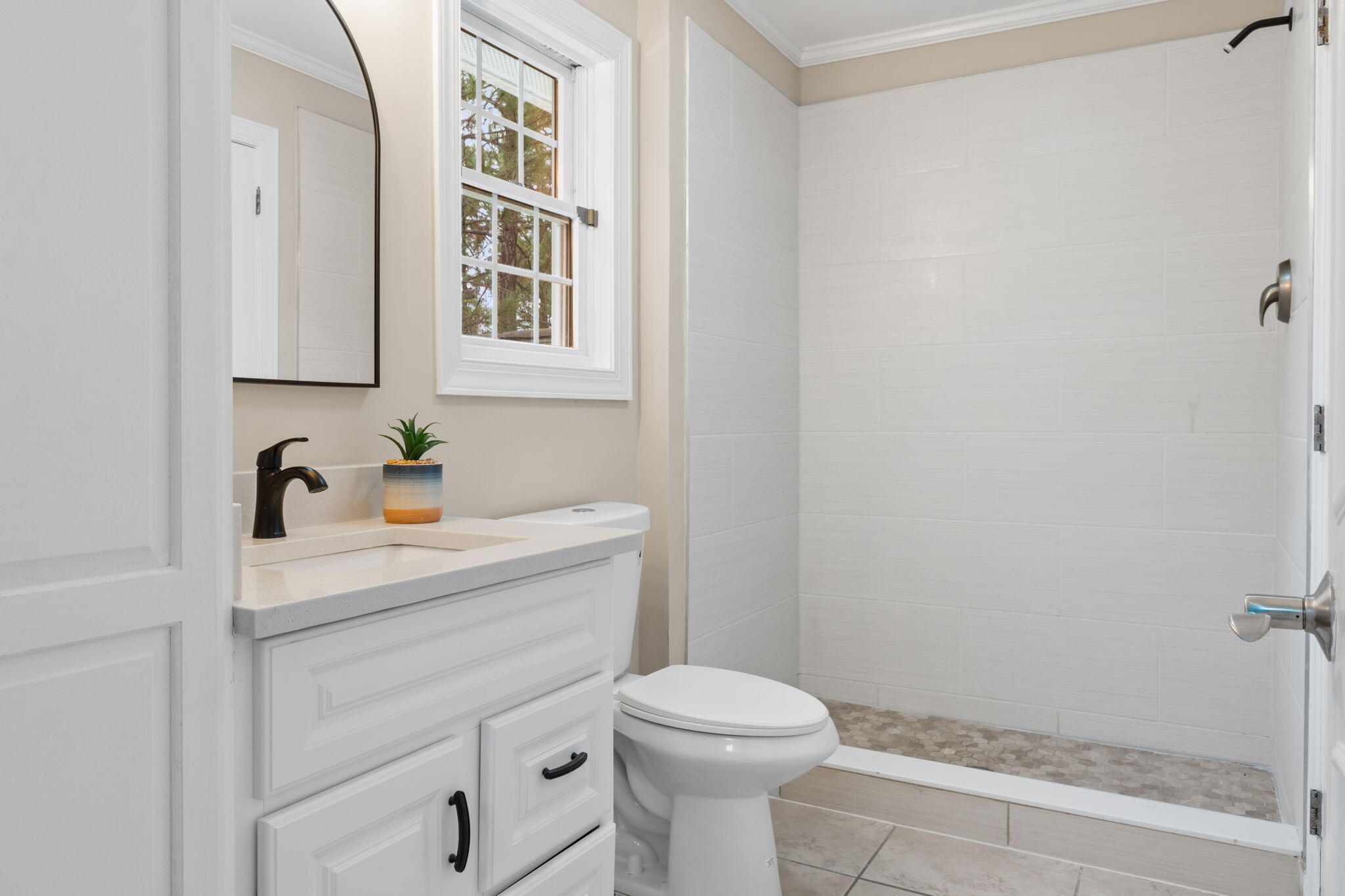 117 Santa Barbara Avenue Santa Rosa Beach, FL 32459 - Photo 42 of 116 a bathroom with a sink a toilet and a window