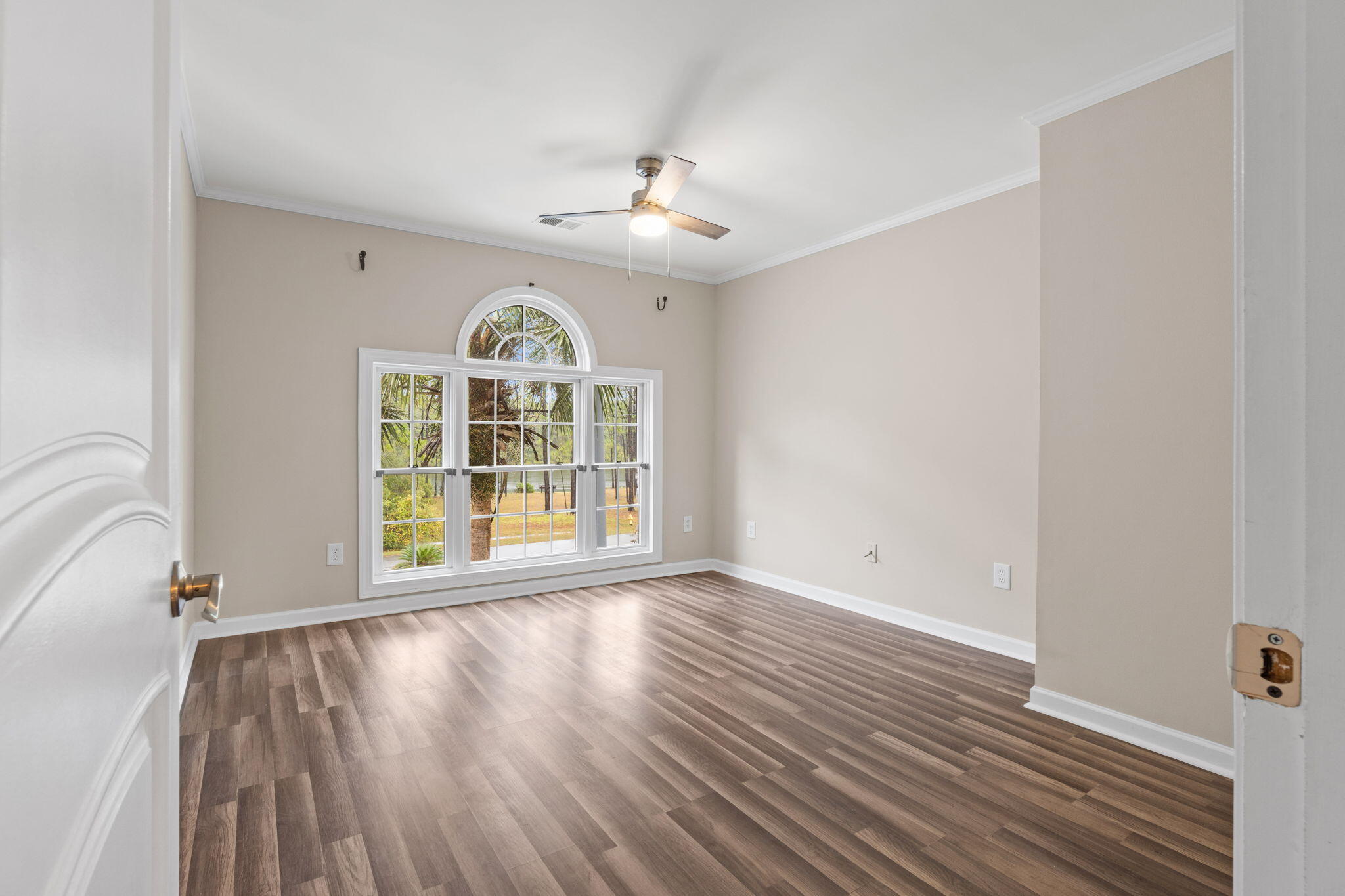 117 Santa Barbara Avenue Santa Rosa Beach, FL 32459 - Photo 48 of 116 wooden floor in an empty room with a window