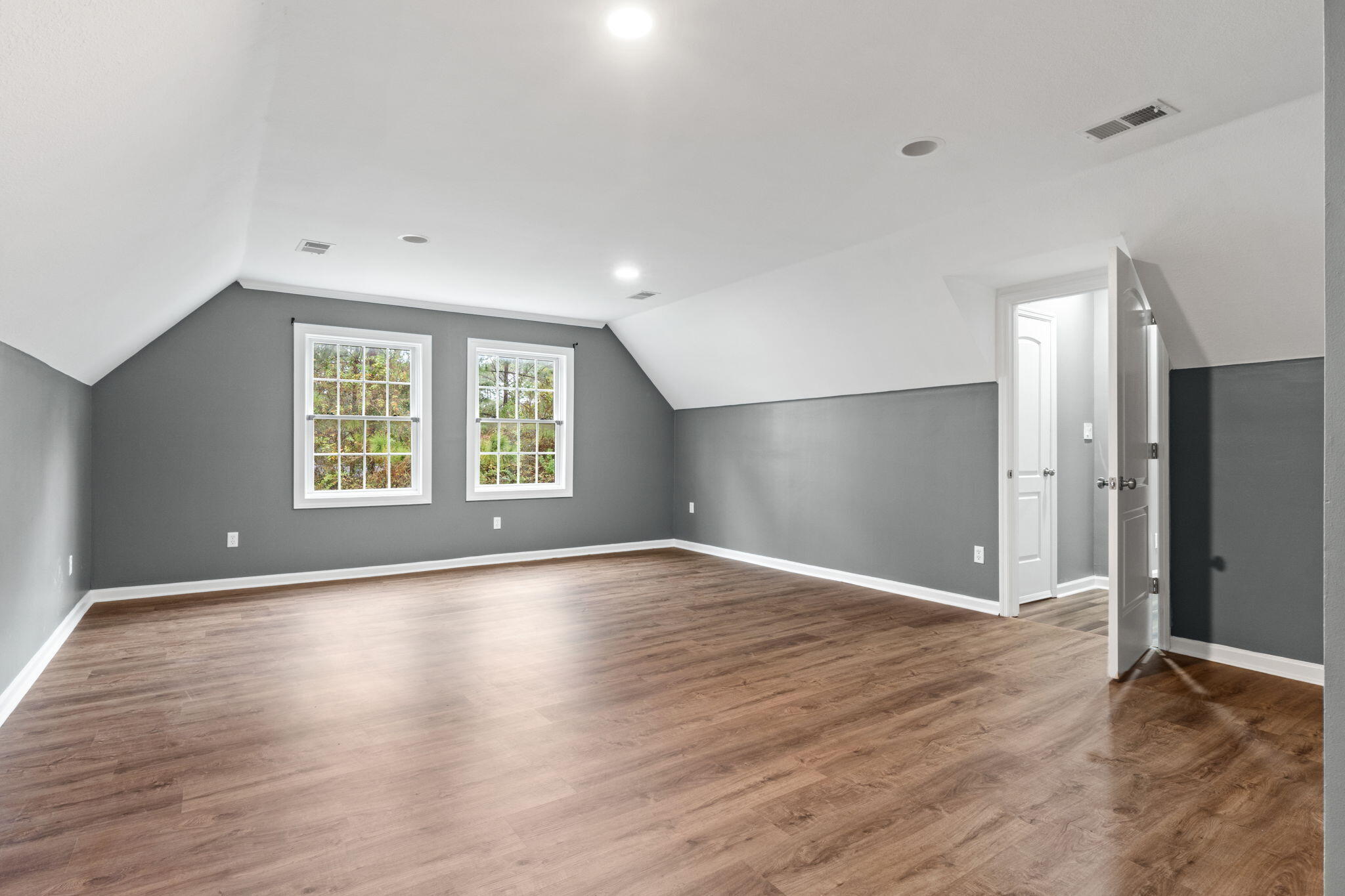 117 Santa Barbara Avenue Santa Rosa Beach, FL 32459 - Photo 51 of 116 an empty room with wooden floor cabinet and windows