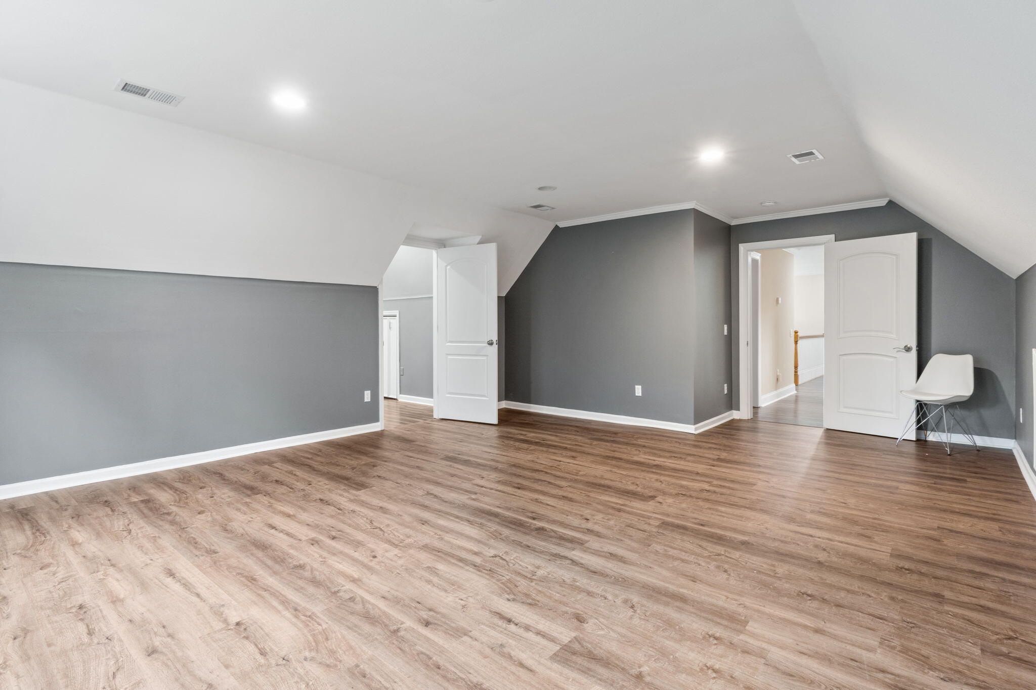 117 Santa Barbara Avenue Santa Rosa Beach, FL 32459 - Photo 52 of 116 a view of an empty room with wooden floor and a window