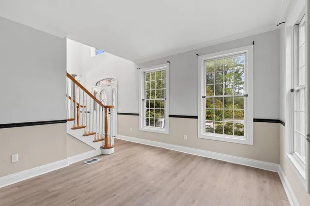 a kitchen with cabinets and a window