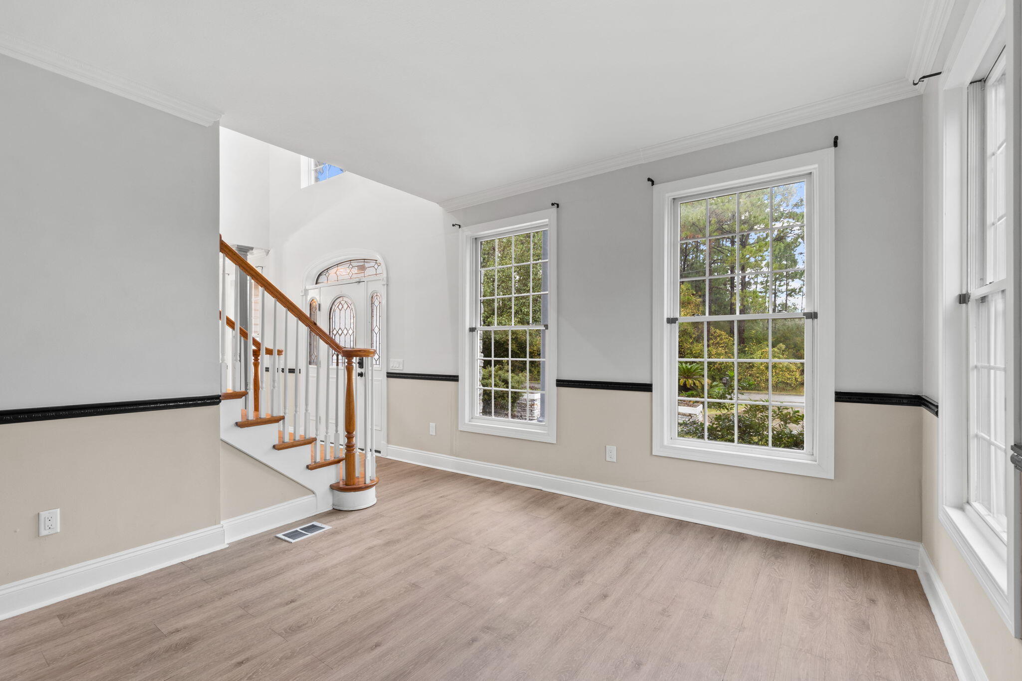 117 Santa Barbara Avenue Santa Rosa Beach, FL 32459 - Photo 8 of 116 a view of an entryway with wooden floor and windows