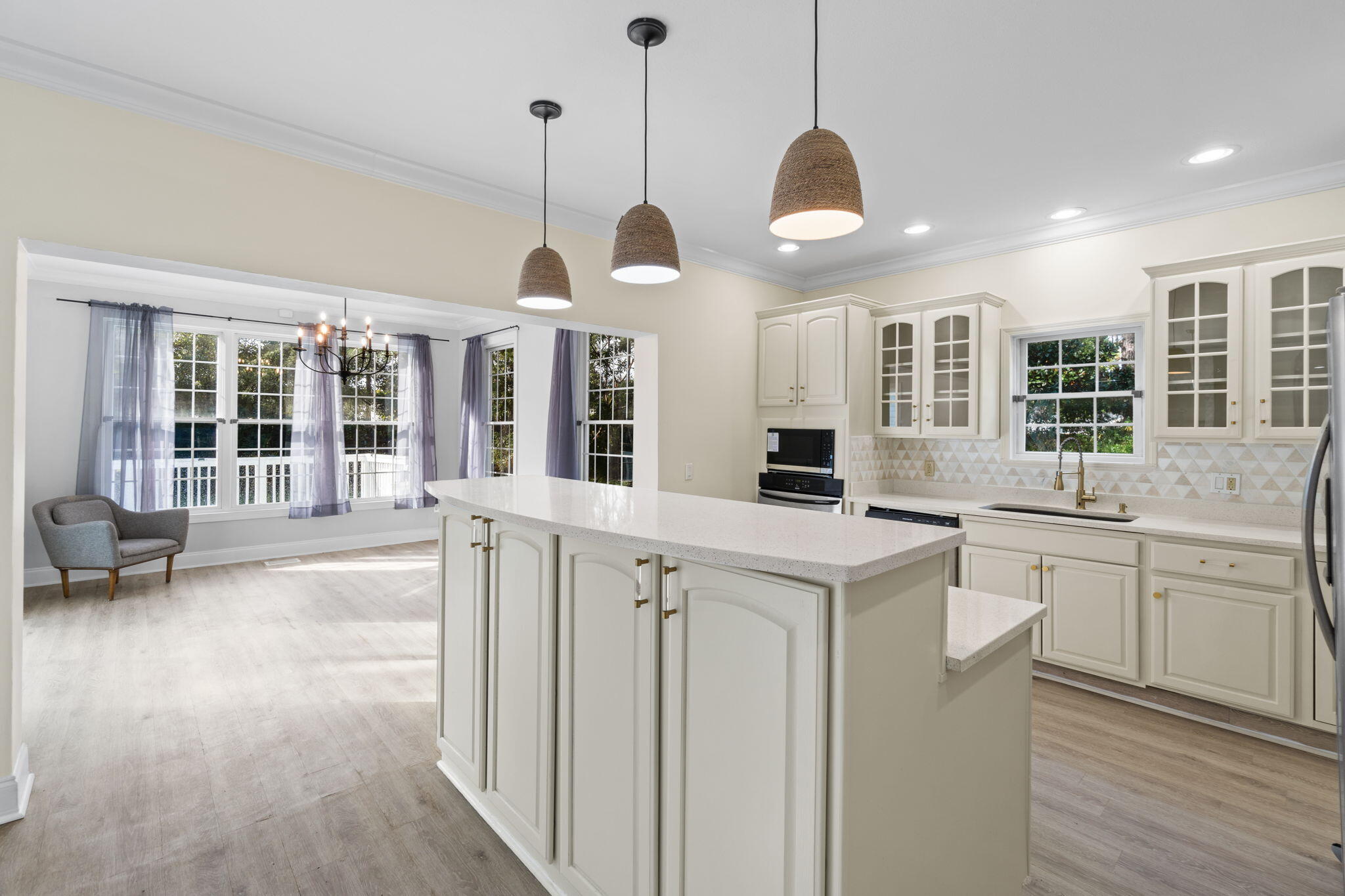117 Santa Barbara Avenue Santa Rosa Beach, FL 32459 - Photo 82 of 116 a kitchen with stainless steel appliances granite countertop stove a sink dishwasher a refrigerator and a dining table with wooden floor