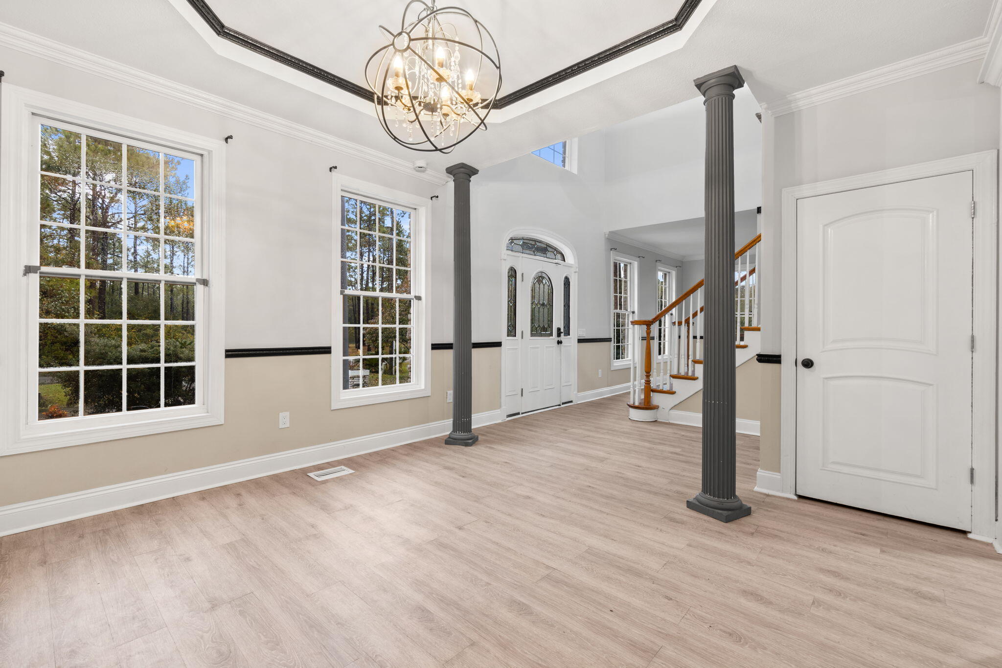 117 Santa Barbara Avenue Santa Rosa Beach, FL 32459 - Photo 10 of 116 a view of empty room with wooden floor and fan