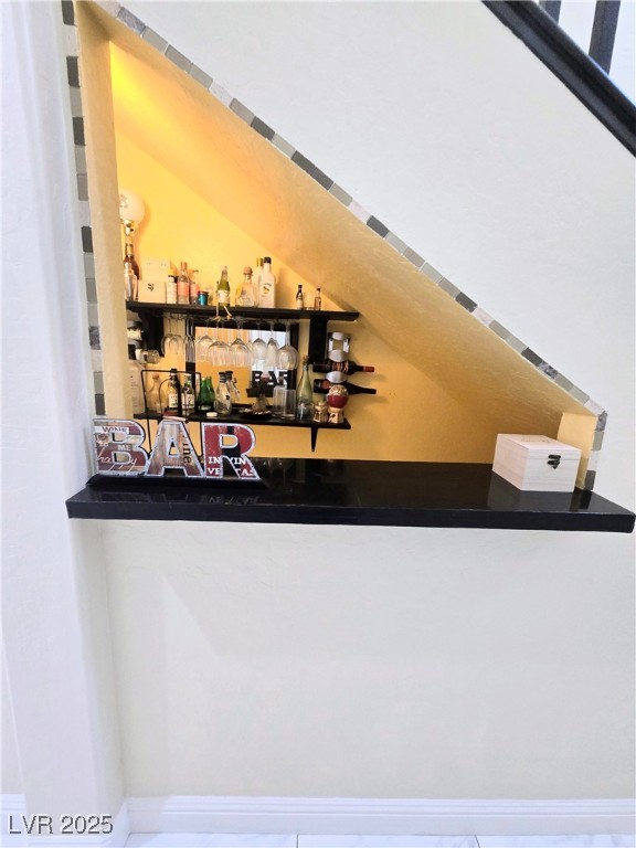 10855 Casco Bay Street Las Vegas, NV 89179 - Photo 13 of 64 Indoor dry bar featuring tile patterned flooring, dark countertops, and open shelves