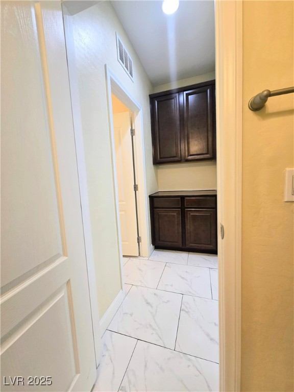 10855 Casco Bay Street Las Vegas, NV 89179 - Photo 43 of 64 Corridor with light marble finish flooring and baseboards