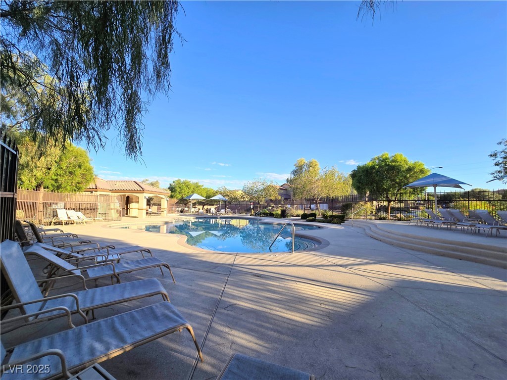 10855 Casco Bay Street Las Vegas, NV 89179 - Photo 60 of 64 Community pool featuring a patio area