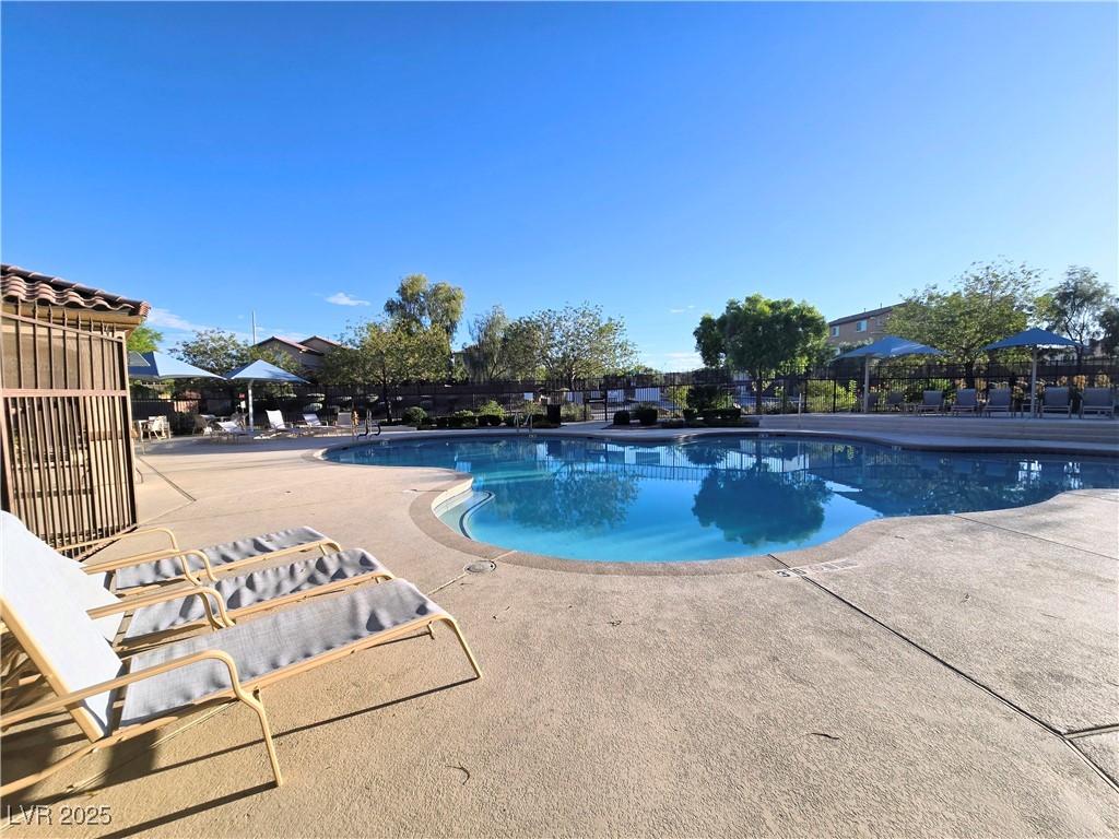 10855 Casco Bay Street Las Vegas, NV 89179 - Photo 61 of 64 Community pool with a patio