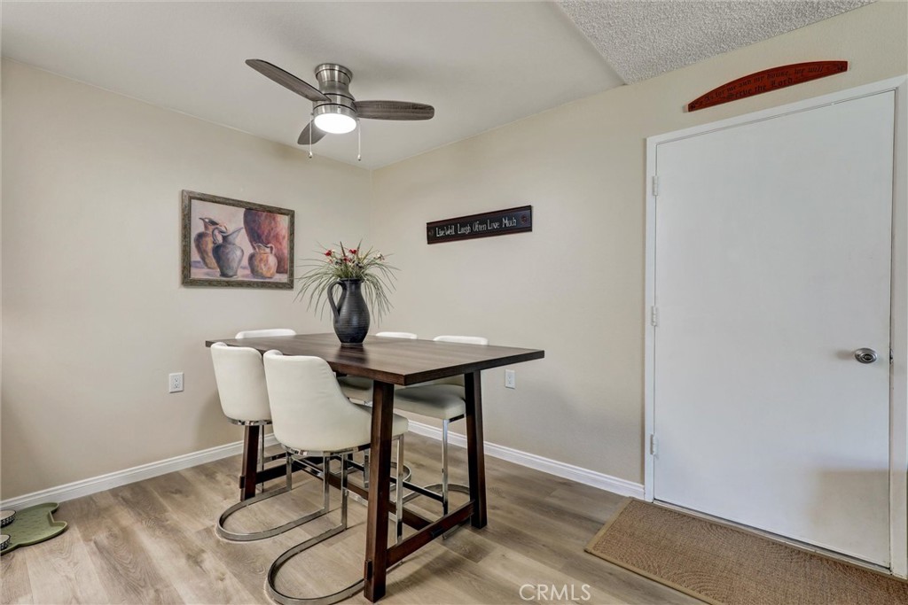 2123 Ronda Granada, Unit G Laguna Woods, CA 92637 - Photo 6 of 37 a view of a workspace with furniture and wooden floor